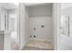 Small laundry closet area with washer and dryer hookups and tile flooring at 2754 Terrell Trace Dr, Marietta, GA 30067