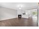 Bright living room with hardwood floors, a fireplace, and an open layout leading to the kitchen at 2754 Terrell Trace Dr, Marietta, GA 30067