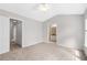 Spacious main bedroom with carpet flooring and entrances to en suite bath and walk-in closet at 2754 Terrell Trace Dr, Marietta, GA 30067