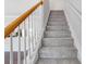 Carpeted stairway with white wood banister and handrail leads upstairs at 2754 Terrell Trace Dr, Marietta, GA 30067