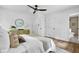 Bedroom featuring a comfortable bed, stylish decor, and an ensuite bathroom with modern fixtures at 5666 Fawn Dr, Powder Springs, GA 30127