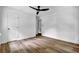 This bedroom features wood-look floors, neutral paint, and a ceiling fan at 5666 Fawn Dr, Powder Springs, GA 30127