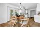 Bright dining area with modern table and chairs and natural light, with kitchen access at 5666 Fawn Dr, Powder Springs, GA 30127