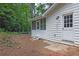 Exterior view of home showing screened-in porch and white siding at 5666 Fawn Dr, Powder Springs, GA 30127