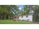Charming home featuring a well-manicured lawn and inviting front porch with wooden stairs at 5666 Fawn Dr, Powder Springs, GA 30127