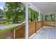 Inviting front porch with wooden railings and a view of the neighborhood street at 5666 Fawn Dr, Powder Springs, GA 30127