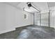 Clean garage with a window and a white door at 5666 Fawn Dr, Powder Springs, GA 30127