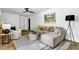 Cozy living room with modern decor, including a plush sectional sofa, accent chairs, and stylish lighting at 5666 Fawn Dr, Powder Springs, GA 30127