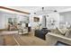 Open-concept living room flows into the dining area and kitchen, perfect for entertaining at 5666 Fawn Dr, Powder Springs, GA 30127