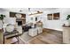 Bright living room featuring a brick fireplace and modern decor and furnishings at 5666 Fawn Dr, Powder Springs, GA 30127