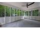 Relaxing screened-in porch with views of the surrounding woods and trees at 5666 Fawn Dr, Powder Springs, GA 30127