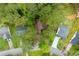 Aerial view of the home, showcasing the roofline, mature trees, and neighborhood setting at 9383 Woodknoll Way, Jonesboro, GA 30238