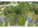 Aerial view of the property highlighting the home's position among mature trees in a residential neighborhood at 9383 Woodknoll Way, Jonesboro, GA 30238