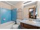 Full bathroom featuring tile, bathtub, a sink, and open shelving at 9383 Woodknoll Way, Jonesboro, GA 30238