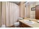 Bathroom with a striped wall design and neutral-toned shower curtain at 9383 Woodknoll Way, Jonesboro, GA 30238
