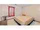 This bedroom features neutral walls, a window with curtains, and an area for a table at 9383 Woodknoll Way, Jonesboro, GA 30238