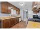 Kitchen featuring laminate counters, stainless steel stove, and wood cabinets at 9383 Woodknoll Way, Jonesboro, GA 30238
