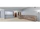 Spacious living room featuring plush carpeting, neutral walls, and ample natural light at 9383 Woodknoll Way, Jonesboro, GA 30238
