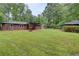 Expansive backyard with a covered patio, fire pit and plenty of open space at 122 Vickery Dr, Fairburn, GA 30213