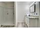 Bright bathroom showcasing an updated vanity with modern fixtures, shower, and neutral flooring at 122 Vickery Dr, Fairburn, GA 30213