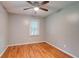 Bedroom with hardwood floors, a ceiling fan, and light-gray paint at 122 Vickery Dr, Fairburn, GA 30213
