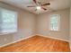 This bedroom features hardwood floors, neutral paint, and great light at 122 Vickery Dr, Fairburn, GA 30213