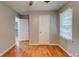 Neutral bedroom with hardwood floors and a doorway leading to other rooms at 122 Vickery Dr, Fairburn, GA 30213