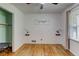 Cozy bedroom showcasing hardwood floors, a ceiling fan, and a charming decorative 'goodnight' sign at 122 Vickery Dr, Fairburn, GA 30213