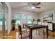Staged dining room featuring a modern table, rug, and sliding door at 122 Vickery Dr, Fairburn, GA 30213