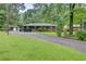 Charming home with a well-manicured front yard and a long driveway at 122 Vickery Dr, Fairburn, GA 30213
