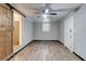 Empty living room features neutral paint, new floors, barn door and lots of natural light at 122 Vickery Dr, Fairburn, GA 30213