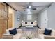 Staged living room with a modern design, comfortable seating, and a sliding barn door at 122 Vickery Dr, Fairburn, GA 30213