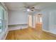 Inviting living room with hardwood floors, bright windows, and neutral paint scheme creating a warm space at 122 Vickery Dr, Fairburn, GA 30213