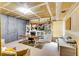 Spacious basement with work space, featuring drywall ceilings and unfinished walls ready for customization to suit your needs at 2200 E Lake E Rd, Mcdonough, GA 30252