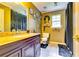 Bathroom featuring granite countertops, decorative wall hangings, and tiled floors for a clean and stylish look at 2200 E Lake E Rd, Mcdonough, GA 30252