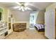 Spacious bedroom featuring interesting angles, a twin bed, carpet and neutral walls at 2200 E Lake E Rd, Mcdonough, GA 30252