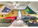 Spacious bedroom with vibrant decor, including themed wall decorations, offering a playful and inviting atmosphere at 2200 E Lake E Rd, Mcdonough, GA 30252