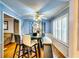 Bright dining room with natural light, wainscotting, and space for entertaining at 2200 E Lake E Rd, Mcdonough, GA 30252