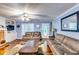 Cozy living room with ample seating, a fireplace, and hardwood floors at 2200 E Lake E Rd, Mcdonough, GA 30252