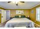 Spacious main bedroom boasts a large bed and comfortable contemporary furnishings at 2200 E Lake E Rd, Mcdonough, GA 30252