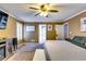 Large main bedroom featuring a fireplace, television, neutral walls and carpet at 2200 E Lake E Rd, Mcdonough, GA 30252