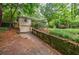 Lovely backyard featuring a swing and a garage accessed by a quaint stone-lined driveway at 4611 Dogwood Rd, Pine Lake, GA 30072