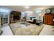 Finished basement offering a cozy atmosphere, stone fireplace, and decorative area rug at 4611 Dogwood Rd, Pine Lake, GA 30072