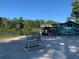 Community lake beach featuring an elevated lifeguard chair and lakeside building at 4611 Dogwood Rd, Pine Lake, GA 30072