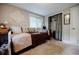 Cozy bedroom showcasing a daybed with decorative pillows, closet with curtain, and decorative wall art at 4611 Dogwood Rd, Pine Lake, GA 30072