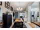 Inviting dining area featuring a wooden table and chairs, with a cabinet at 4611 Dogwood Rd, Pine Lake, GA 30072