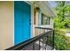 Close-up of the home's bright blue front door, featuring black hardware and a modern light fixture at 4611 Dogwood Rd, Pine Lake, GA 30072