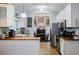 White kitchen with wood countertops overlooks the dining area, creating an open and inviting atmosphere at 4611 Dogwood Rd, Pine Lake, GA 30072