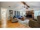 Inviting living room features vaulted ceilings, a brick fireplace, and hardwood floors at 4611 Dogwood Rd, Pine Lake, GA 30072