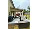 Inviting backyard featuring a covered patio with stylish outdoor furniture and a grill at 558 Hideaway Dr, Jonesboro, GA 30238